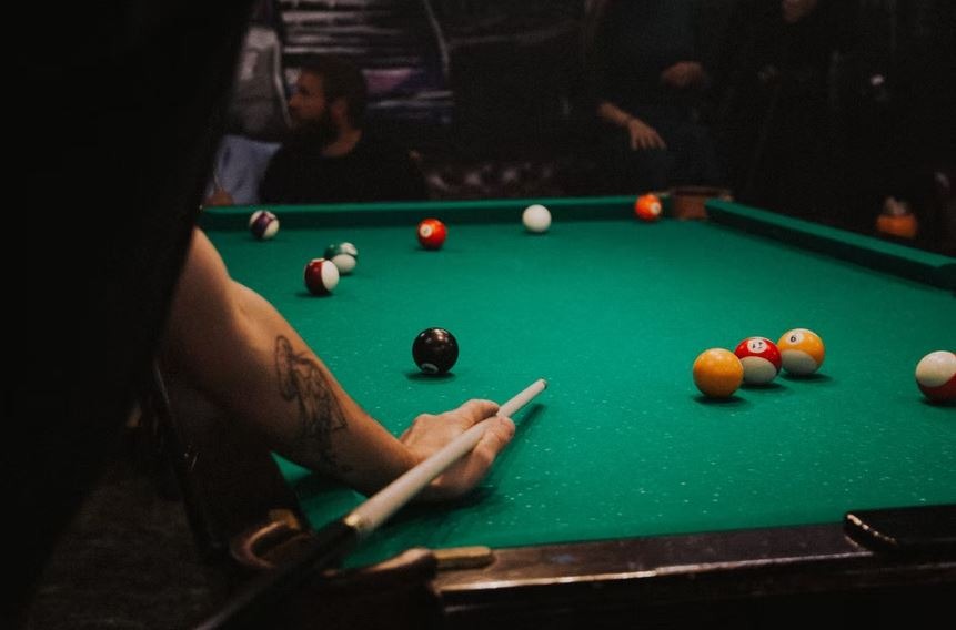 man playing a game of pool