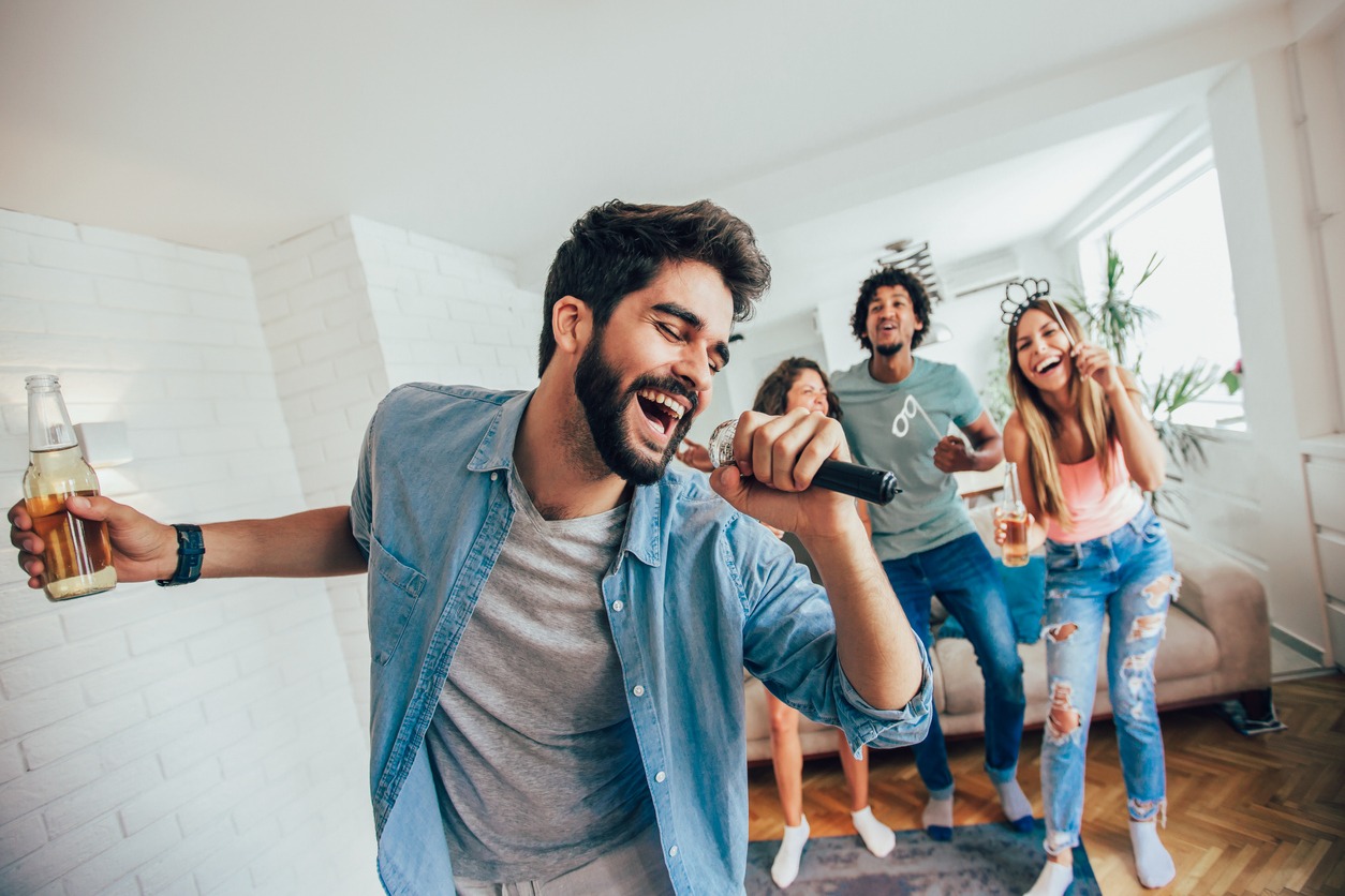 Group of friends cheering on to the singer