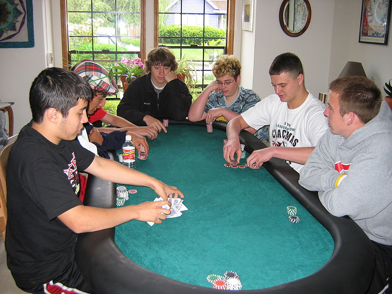 Men playing poker at a poker table at home