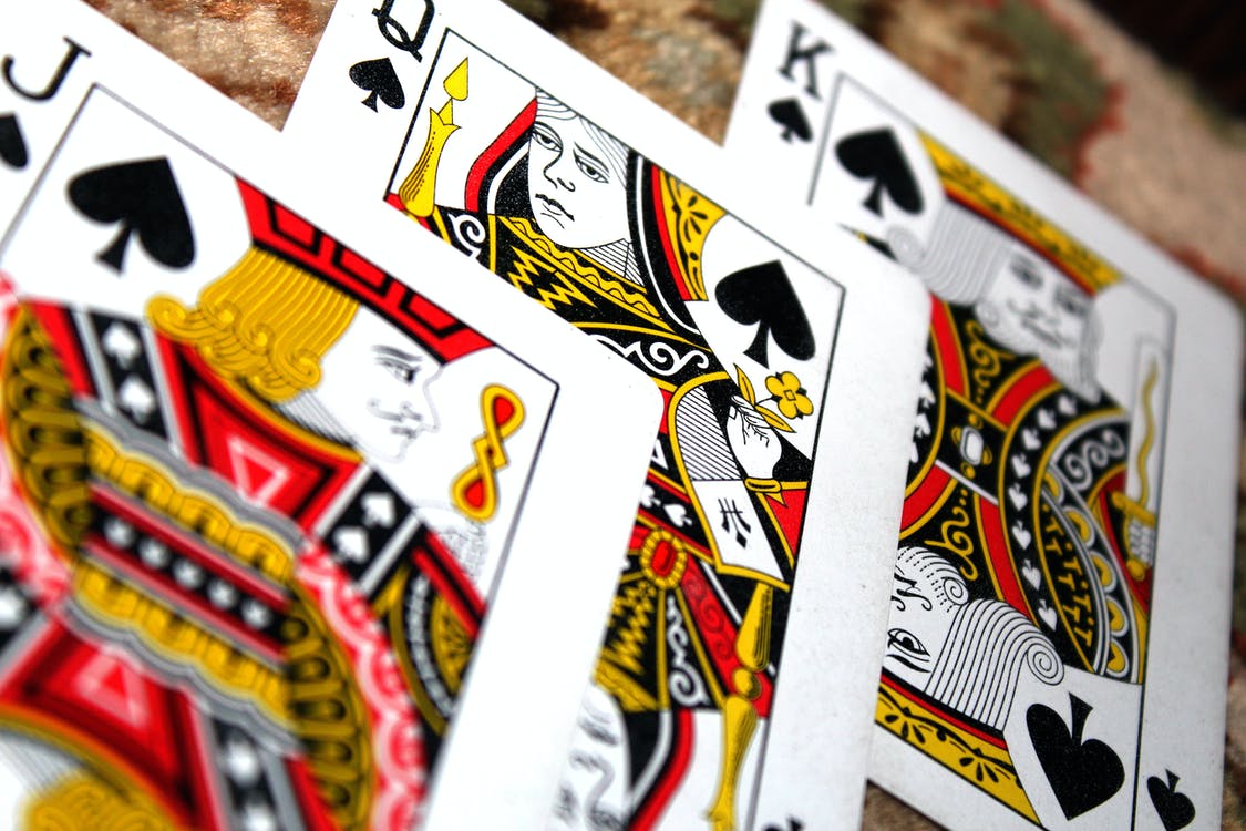 king, queen, and jack cards)