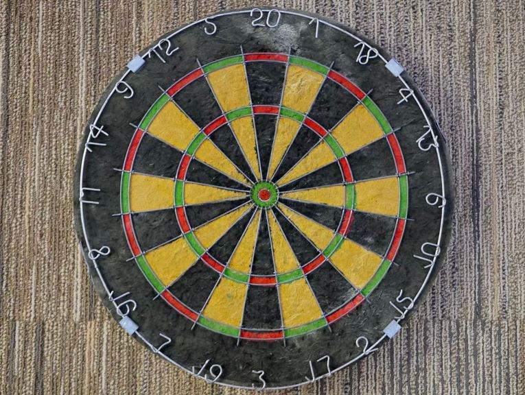 a dartboard hanging on the wall