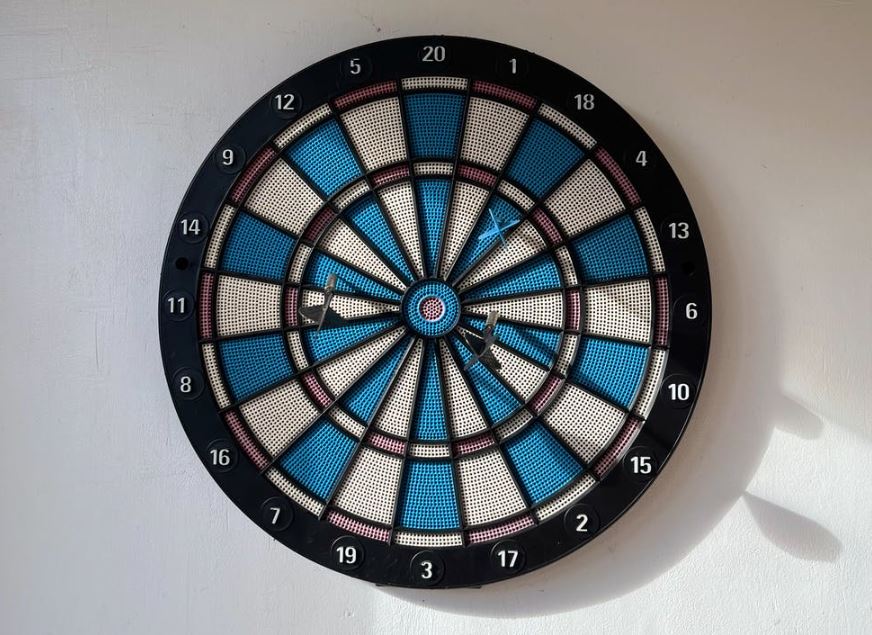 a dartboard fixed on a wall