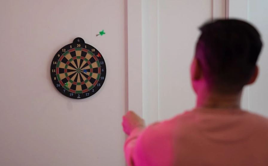 Mounting your dartboard on a wall can be safe but may cause wall damage