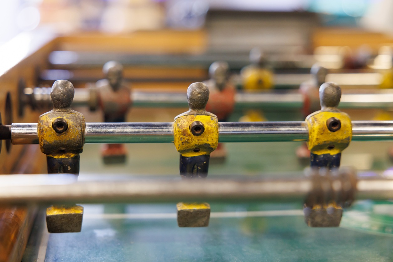 A close-up photo of dirty foosball players